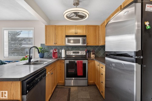 176 230 Edwards Drive, Edmonton, AB - Indoor Photo Showing Kitchen With Stainless Steel Kitchen With Double Sink