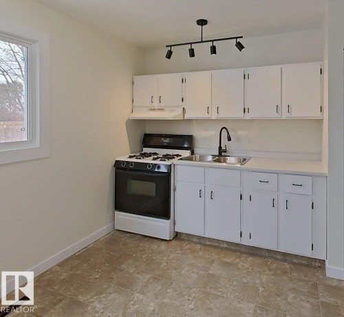 4507 35 Avenue, Edmonton, AB - Indoor Photo Showing Kitchen With Double Sink