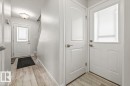Entryway featuring light-toned flooring, white walls, and a staircase with light-colored carpeting - 12C Castle Terrace, Edmonton, AB  - Indoor Photo Showing Other Room 