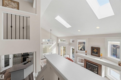 Expansive interior with vaulted ceilings, skylights, and recessed lighting - 31 Everitt Drive, St. Albert, AB - Indoor Photo Showing Other Room With Fireplace