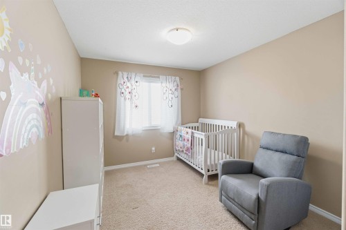 This room features neutral-toned walls, carpeted flooring, and a window with blinds - 31 Everitt Drive, St. Albert, AB - Indoor Photo Showing Bedroom