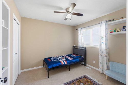 This room features neutral-toned walls, a ceiling fan, and carpeted flooring - 31 Everitt Drive, St. Albert, AB - Indoor Photo Showing Bedroom