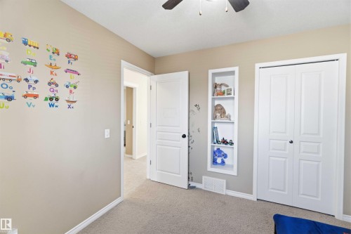 Bedroom featuring neutral-toned walls, carpeted flooring, and a ceiling fan - 31 Everitt Drive, St. Albert, AB - Indoor