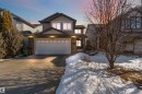 The property features a two-story exterior with a stone accent facade and a two-car garage - 31 Everitt Drive, St. Albert, AB  - Outdoor 