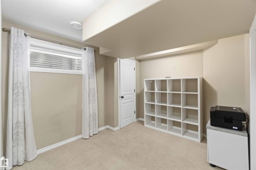 This room features a window with blinds, light-colored walls, and carpeted flooring - 31 Everitt Drive, St. Albert, AB - Indoor Photo Showing Other Room