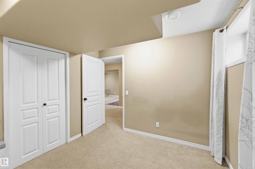 This room features neutral-toned walls, white trim, and carpeted flooring - 31 Everitt Drive, St. Albert, AB - Indoor Photo Showing Other Room