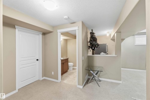This inviting interior space features neutral-toned walls, light-colored carpeting, and white trim throughout - 31 Everitt Drive, St. Albert, AB - Indoor