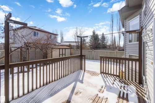 Expansive outdoor deck with a wooden railing - 31 Everitt Drive, St. Albert, AB - Outdoor With Deck Patio Veranda With Exterior