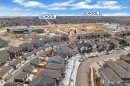 Aerial view of the neighborhood showcasing a residential street with properties and a nearby school building - 1645 Plum Circle, Edmonton, AB  - Outdoor With View 