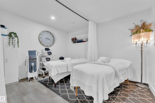 This room features light-colored flooring and white walls, creating a bright atmosphere - 1645 Plum Circle, Edmonton, AB - Indoor Photo Showing Bedroom
