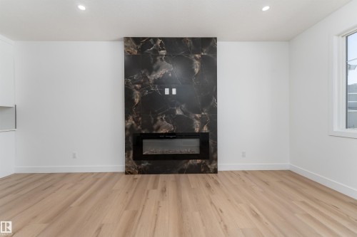 3117 Magpie Way, Edmonton, AB - Indoor Photo Showing Other Room With Fireplace