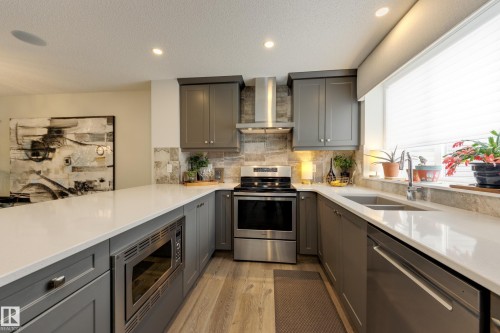 596 Stout Bend, Leduc, AB - Indoor Photo Showing Kitchen With Stainless Steel Kitchen With Double Sink With Upgraded Kitchen