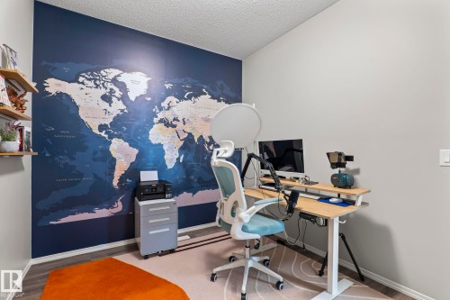 Well-appointed room featuring a large wall map, light-colored walls, and wood-look flooring - 5164 Lark Crescent Nw, Edmonton, AB - Indoor Photo Showing Office