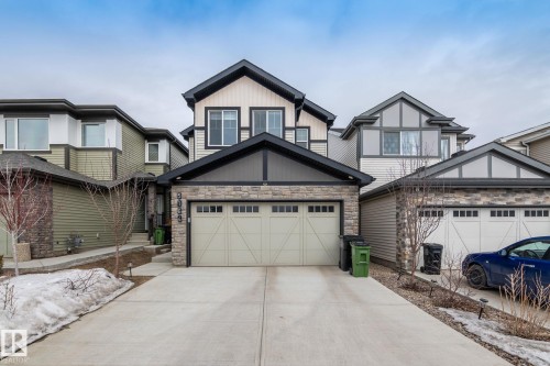 The property features a two-story design with a prominent front-facing garage - 5164 Lark Crescent Nw, Edmonton, AB - Outdoor