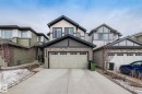 The property features a two-story design with a prominent front-facing garage - 5164 Lark Crescent Nw, Edmonton, AB  - Outdoor 