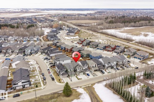 Aerial view showcasing the property within a residential neighborhood featuring detached homes and paved streets - 5164 Lark Crescent Nw, Edmonton, AB - Outdoor With View