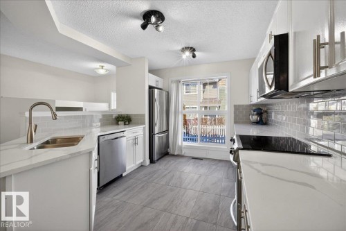 174 5604 199 Street, Edmonton, AB - Indoor Photo Showing Kitchen With Stainless Steel Kitchen With Double Sink