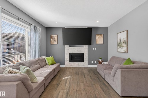 457 Meadowview Drive, Fort Saskatchewan, AB - Indoor Photo Showing Living Room With Fireplace