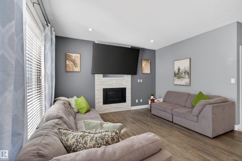 457 Meadowview Drive, Fort Saskatchewan, AB - Indoor Photo Showing Living Room With Fireplace