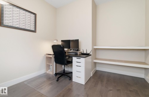 This room features light-colored walls and dark wood flooring - 3235 Abbott Crescent, Edmonton, AB - Indoor Photo Showing Office