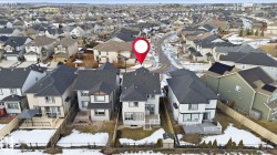 Aerial view of the property and the surrounding neighborhood - 