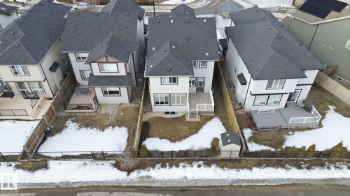 The property features a private backyard with a deck and a storage shed, enclosed by a fence - 3235 Abbott Crescent, Edmonton, AB - Outdoor