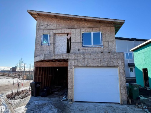 The property features a modern architectural design with a sloped roofline - 2740 Blatchford Road, Edmonton, AB - Outdoor