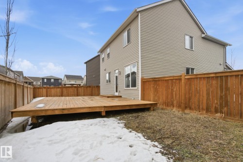 The property features a spacious wooden deck, ideal for outdoor enjoyment - 1607 202 Street, Edmonton, AB - Outdoor With Exterior