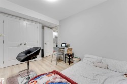 This room features light-colored flooring and white walls, creating a bright and airy atmosphere - 