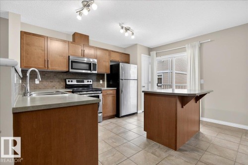 96 1804 70 Street, Edmonton, AB - Indoor Photo Showing Kitchen With Stainless Steel Kitchen With Double Sink