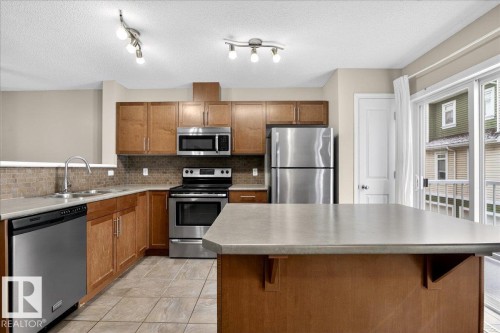 96 1804 70 Street, Edmonton, AB - Indoor Photo Showing Kitchen With Stainless Steel Kitchen With Double Sink
