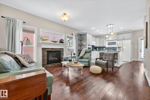 120 Keyport Circle, Leduc, AB - Indoor Photo Showing Living Room With Fireplace