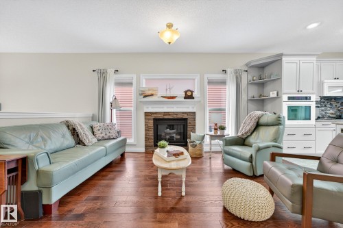 120 Keyport Circle, Leduc, AB - Indoor Photo Showing Living Room With Fireplace