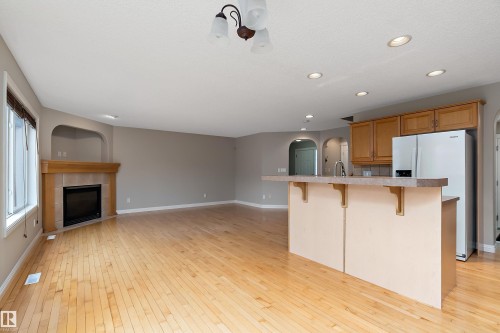2176 Haddow Drive, Edmonton, AB - Indoor Photo Showing Kitchen With Fireplace