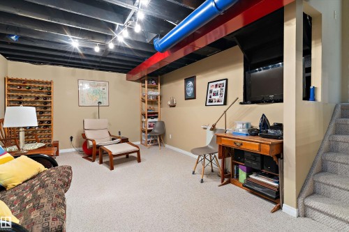 Recreation room featuring carpeted flooring, painted ceiling beams, and recessed lighting - 322 Pearson Crescent, Edmonton, AB - Indoor Photo Showing Basement