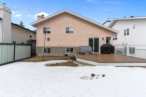 The property features a spacious deck with white railings, offering outdoor living space - 322 Pearson Crescent, Edmonton, AB - Outdoor With Exterior
