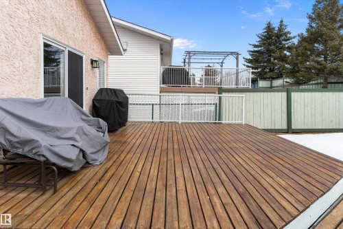 The property features a spacious wooden deck, ideal for outdoor enjoyment - 322 Pearson Crescent, Edmonton, AB - Outdoor With Exterior