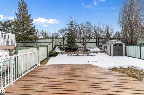 The property features a spacious deck, a fenced yard, and a shed for additional storage - 322 Pearson Crescent, Edmonton, AB - Outdoor With Exterior