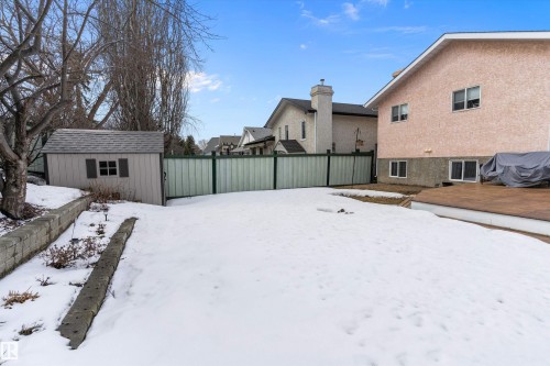 The property includes a spacious yard with a shed and a wooden deck - 322 Pearson Crescent, Edmonton, AB - Outdoor
