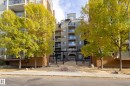 The property is a multi-story building featuring balconies with glass railings - 209 10235 112 Street, Edmonton, AB  - Outdoor With Balcony 