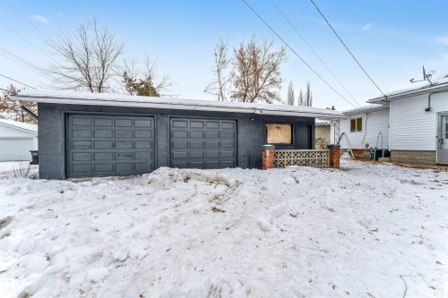 Detached garage with two bays and a gray exterior finish - 12423 91 Street, Edmonton, AB - Outdoor