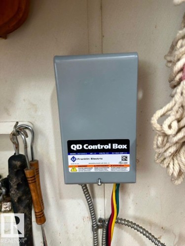 The property includes a Franklin Electric QD Control Box with visible electrical wiring - 50124 Range Road 203, Rural Beaver County, AB - Indoor