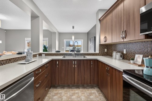 389 Simmonds Way, Leduc, AB - Indoor Photo Showing Kitchen With Double Sink