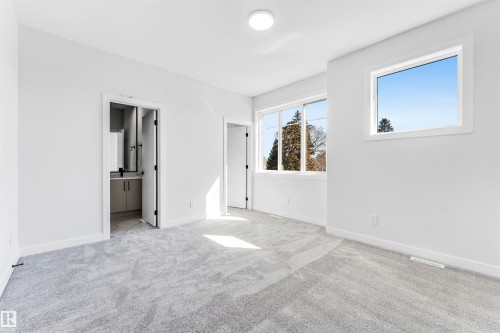 The room features light gray carpeting, white walls, and a recessed ceiling light - 10962 157 Street, Edmonton, AB - Indoor Photo Showing Other Room