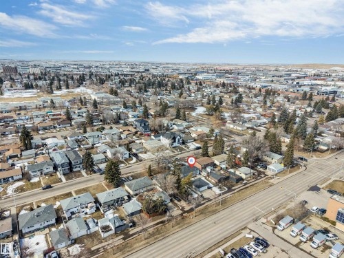 Aerial view showcasing the property within a residential neighborhood featuring established trees and a clear sky overhead - 10962 157 Street, Edmonton, AB - Outdoor With View