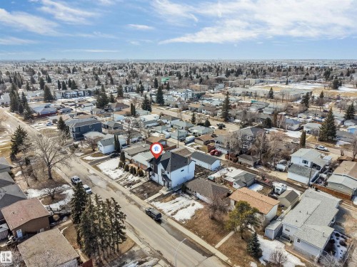 Aerial view of the property and surrounding neighborhood, featuring residential homes and trees - 10962 157 Street, Edmonton, AB - Outdoor With View