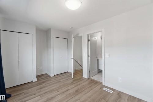 This room features light-toned flooring and white walls, creating a bright atmosphere - 49 100 Jensen Lakes Boulevard, St. Albert, AB - Indoor Photo Showing Other Room