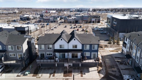 The property features a multi-level design with a light gray and white exterior - 49 100 Jensen Lakes Boulevard, St. Albert, AB - Outdoor