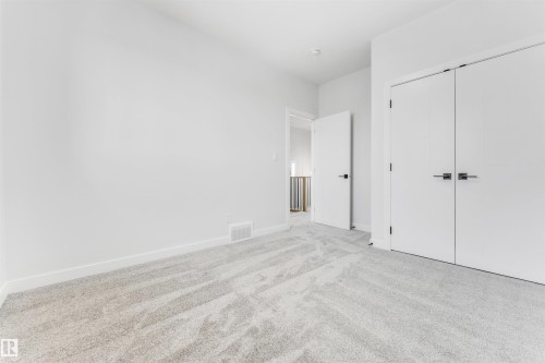 This room features light-colored carpeting, white walls, and white trim - 10964 157 Street, Edmonton, AB - Indoor Photo Showing Other Room