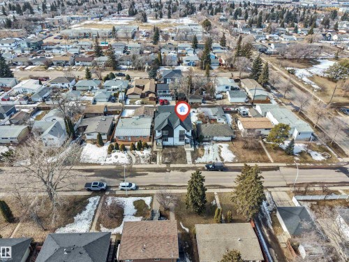 This property is situated on a street with a sidewalk, and features a front yard with some landscaping - 10964 157 Street, Edmonton, AB - Outdoor With View